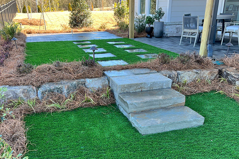 back yard of house with turf installed